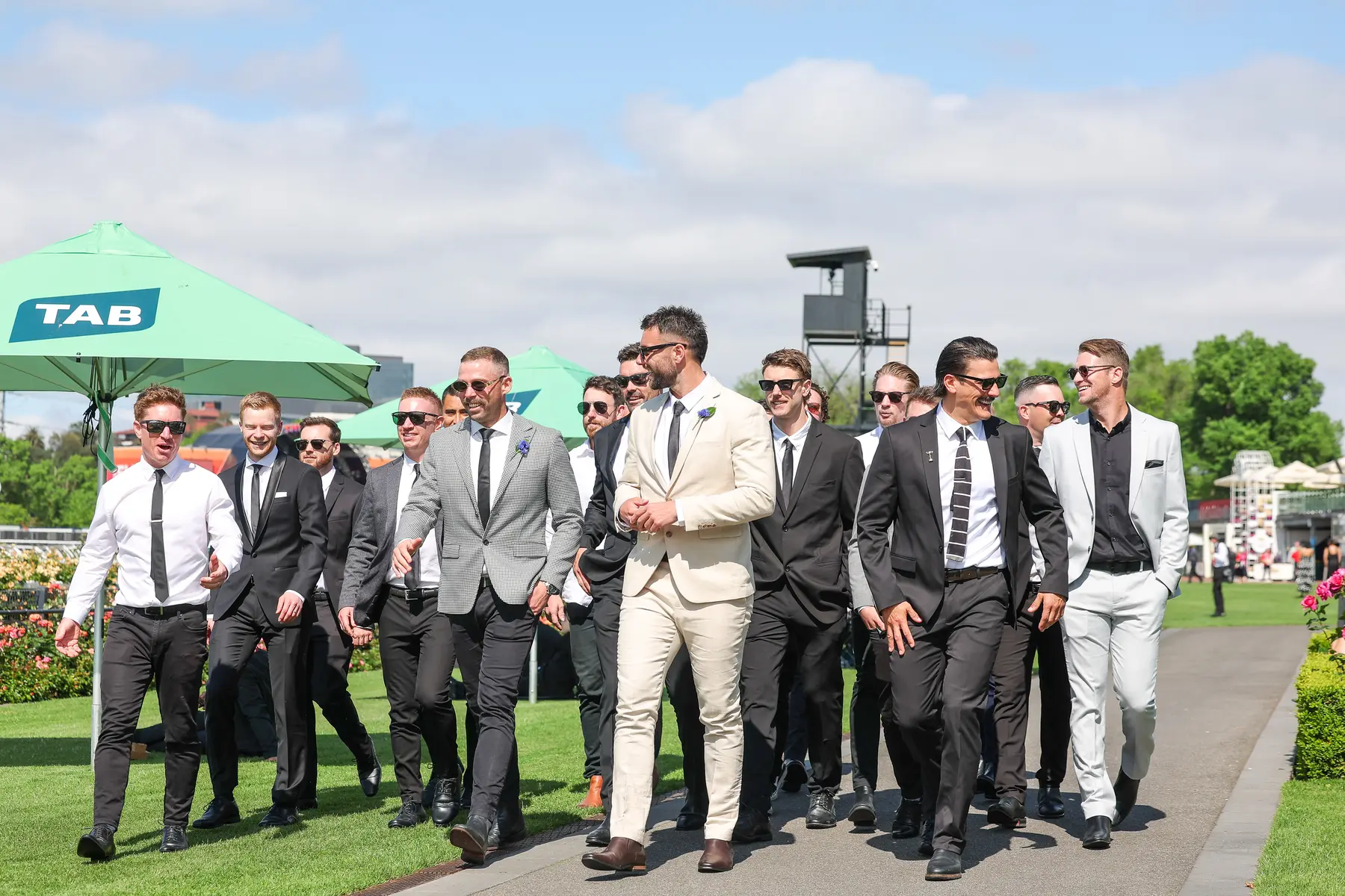Racegoers enjoying a group day at Flemington Racecourse for a Melbourne Cup boat charter